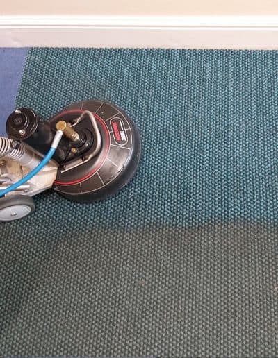 Badly soiled school carpet deep cleaned.